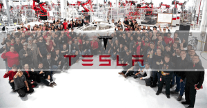 Tesla Work Culture highlighting employees collaborating in a fast-paced, high-performance workplace focused on innovation and sustainable energy.
