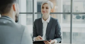 HR professional with social work background supporting employees in a workplace discussion