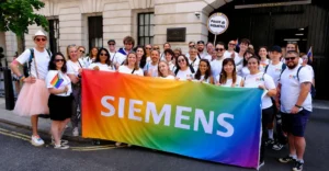 Siemens Company Culture reflected through employees collaborating in a modern workplace focused on learning, leadership development, and innovation.