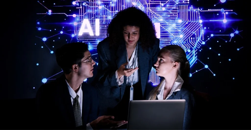 AI is reshaping the leadership pipeline as business professionals collaborate around a laptop with a futuristic AI technology backdrop