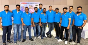 Britannia employee engagement with a team of employees wearing matching blue shirts at a corporate event