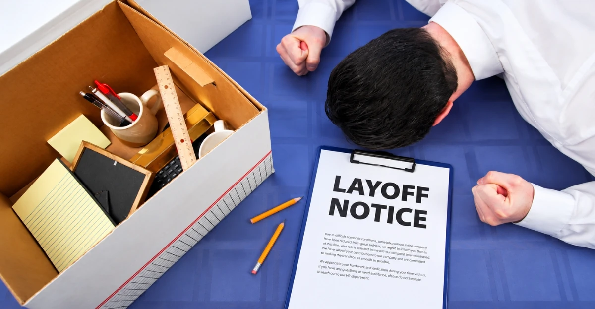Empty office desks illustrating return to office quiet layoffs