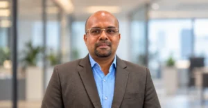Dr. Balanagarajan K professional portrait in a corporate office for talent transformation in the AI era